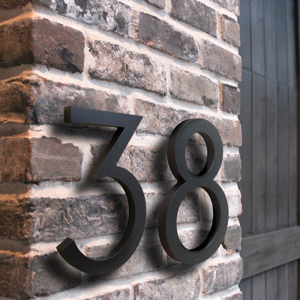 Números de metal en relieve para fachada